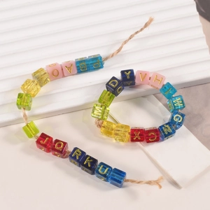 Alphabet resin cube beads for DIY bracelets featuring colorful blocks and gold letters