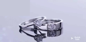 Detail of adjustable couple rings with round brilliant-cut diamonds and polished silver finish