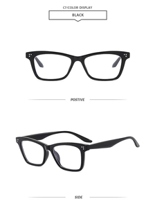 Close-up of black retro square sunglasses featuring distinctive silver triple rivet detailing