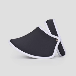 Detail showing the black sun visor with white piping and metallic side buckle fasteners