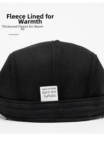 Detailed macro view of the thick black faux fur lining and PU leather edge of the winter hat