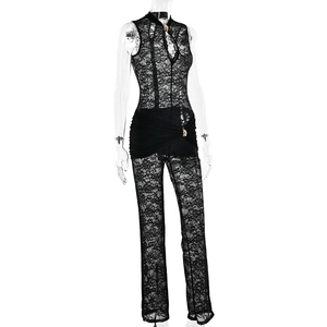 Detail of black lace jumpsuit featuring a zipper stand collar and ruched waist design
