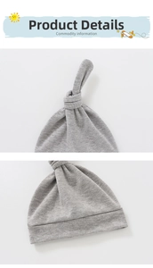 Detail view of the soft grey knit baby knot hat showing top knot and stitching quality