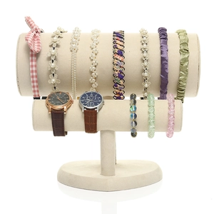 Beige velvet two-tier T-bar jewelry display stand with a heart-shaped base for headbands
