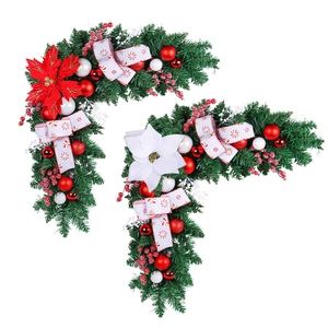 L-shaped Christmas door corner garland with festive pine needles, red berries and ornaments