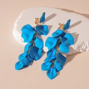 Detail of blue petal earrings with long gold tassel and matte acrylic finish