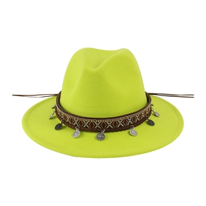 Detail of neon green wool fedora featuring ethnic woven band and silver coin pendants