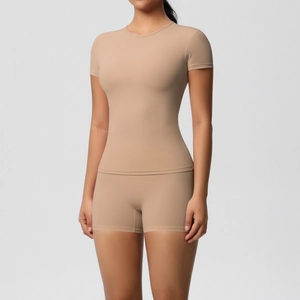 Front view of seamless high-stretch yoga set with slim-fit short sleeve top and shorts