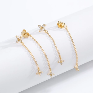 Detailed close-up of S925 silver flower stud earring with chain tassel and zircon stones