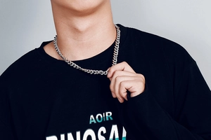 Close-up of a silver Cuban link chain necklace for men made of polished stainless steel