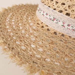 Straw sun hat with hollowed-out texture, floral lace embroidery and fringe brim for summer