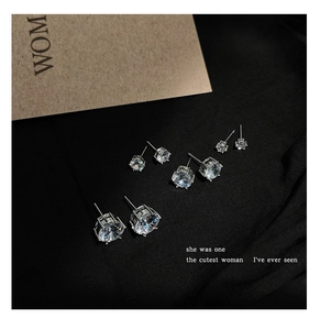 Detailed set of four silver stud earrings with sparkling cubic zirconia in various sizes