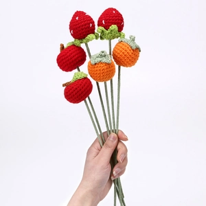 Handmade crochet fruit bouquet featuring knitted strawberry, apple and persimmon gifts