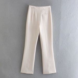 Detailed flat lay of beige high-waisted straight trousers with pleated front and back pocket