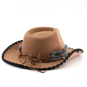 Detail of camel wool fedora hat with bohemian woven band and black stitched brim edge