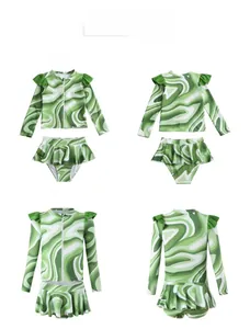 Two-piece girls long sleeve swimsuit with green marble wave print and ruffled skirt