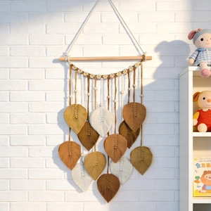 Hand-woven macrame leaf wall hanging with daisy details for bohemian home decor