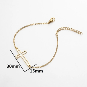 Minimalist gold cross charm chain bracelet with lobster clasp on white background