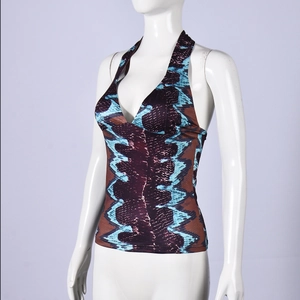 Detail of snake print halter top with deep V-neck and mesh patchwork for party wear