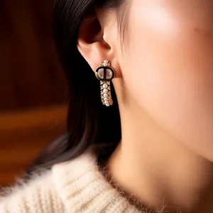 18k gold plated C-shaped earrings with CD initials and elegant hanging pearls