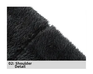 Shoulder detail of black polar fleece hoodie showing dense plush texture and seams