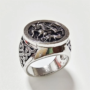 Vintage silver signet ring for men with equestrian knight horse relief on white background