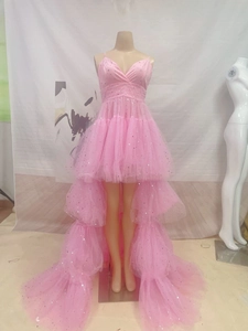 Detailed close-up of pink high-low tulle dress with silver sparkling sequins and v-neck