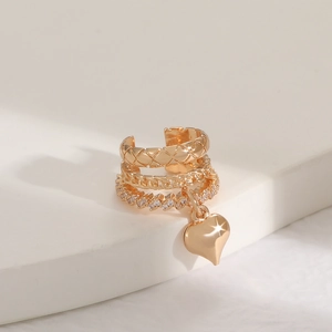 Gold layered ear cuff set with quilted pattern and zircon heart pendant on white stand