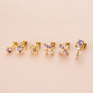 Set of 6 gold stainless steel cartilage studs with purple zircon hearts and bows