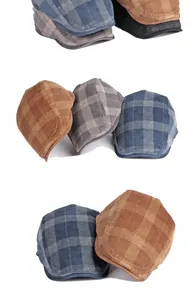 Detailed texture of plaid corduroy flat cap showing high-quality vintage fabric weave