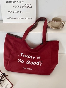 Large reversible red suede tote bag with plaid lining and Today is So Good slogan