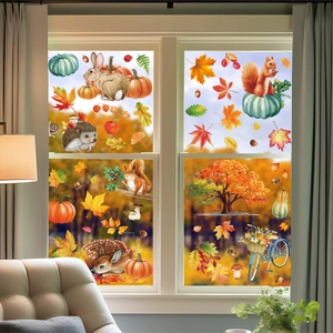 Stickers de Thanksgiving avec feuilles d'automne, animaux et citrouilles sur fenêtres