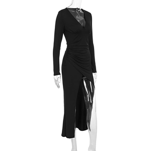 Detail of waist ruching and high slit design on a sleek black slim-fit maxi dress