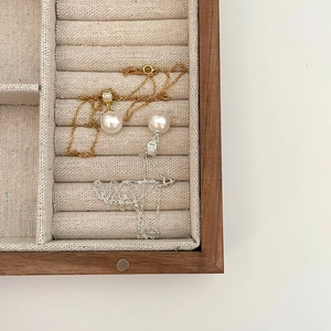 Elegant pearl pendant necklace with rectangular zircon in a wooden jewelry box