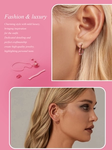 Detailed view of the pink heart earring and necklace set displayed on a pink background