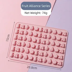 Pink food-grade silicone gummy mold with fruit shapes including pineapple and cherry
