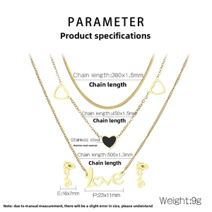 Detailed view of layered gold stainless steel necklace set with heart pendant and love studs