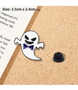 Detailed view of white enamel ghost brooch with purple bow, measuring 2.5cm by 2.4cm