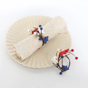 Patriotic red white and blue star napkin rings with berries for 4th of July table decor