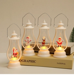 Close-up of four white LED Christmas lanterns with Santa, Snowman and Reindeer figurines