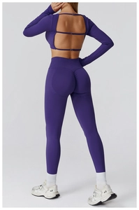 Detail of purple seamless yoga set showing open back cutout and ruched booty leggings