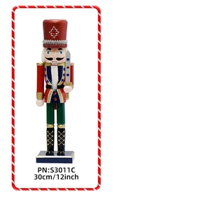 Close-up of a 30cm glittery Nutcracker soldier ornament holding a gold sword on a stand