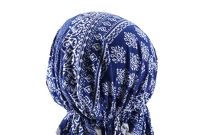 Detail view showing blue paisley print headscarf with ethnic patterns from the back