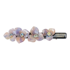 Close-up of floral acetate hair clip with iridescent resin petals and crystal centers