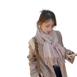 Pink plaid cashmere-like scarf for women showing a stylish autumn winter shawl wrap