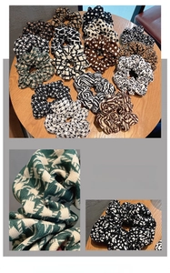 Detailed view of various patterns including houndstooth and leopard print fabric scrunchies
