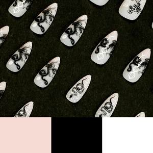 Long almond press-on nails with grey matte finish and black dragon pattern art
