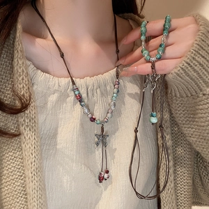 Ethnic beaded layered necklace and bracelet set with silver butterfly pendant