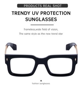 Detail of black square glasses frame with elegant gold rivet accents and UV lenses