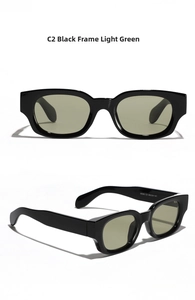 Close-up of black retro square sunglasses with light green lenses and model printing
